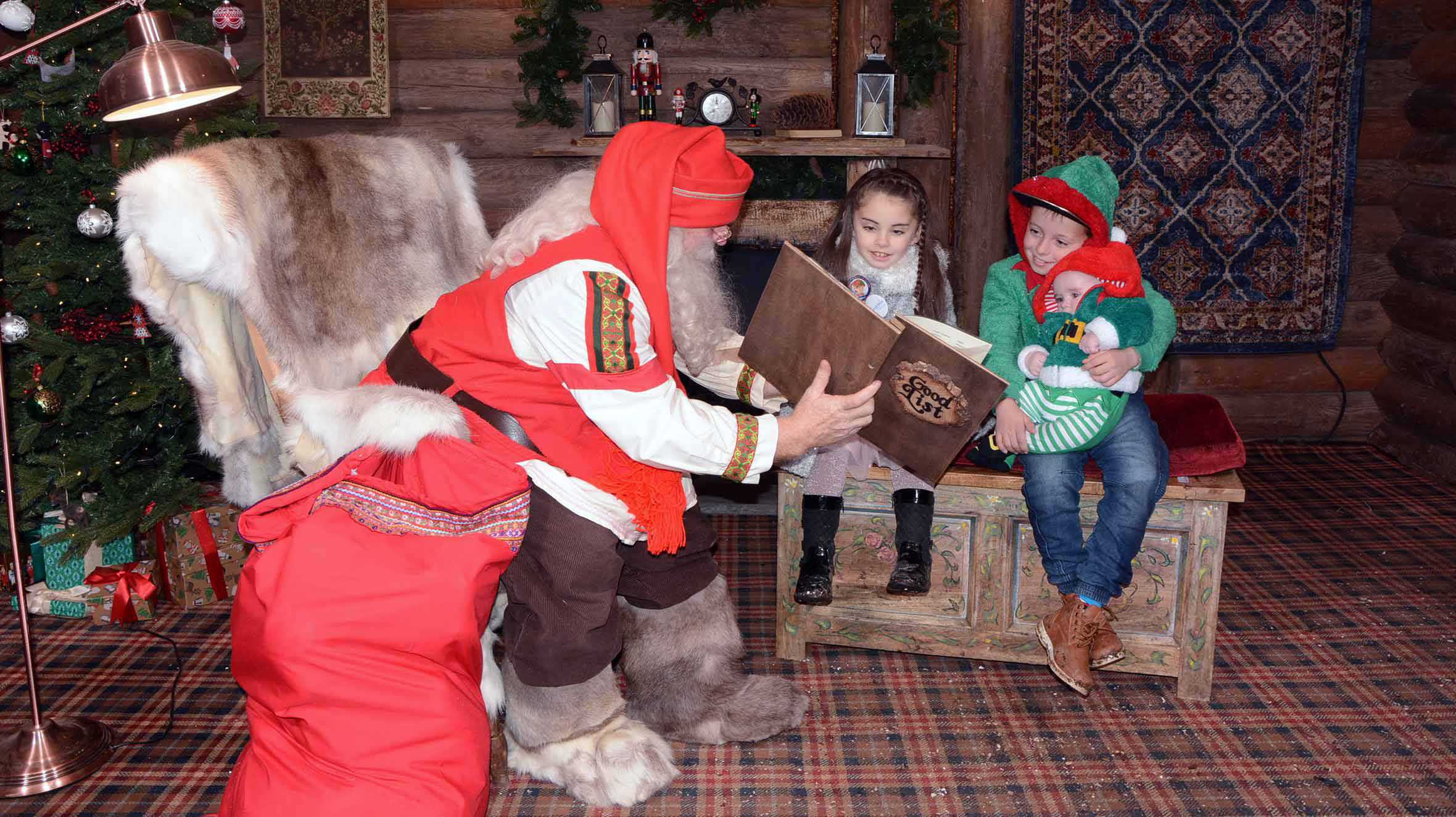 Ella and her siblings meeting Santa at Lapland UK