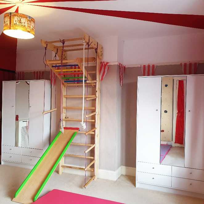 Lottie's wall mounted climbing frame, complete with slide.