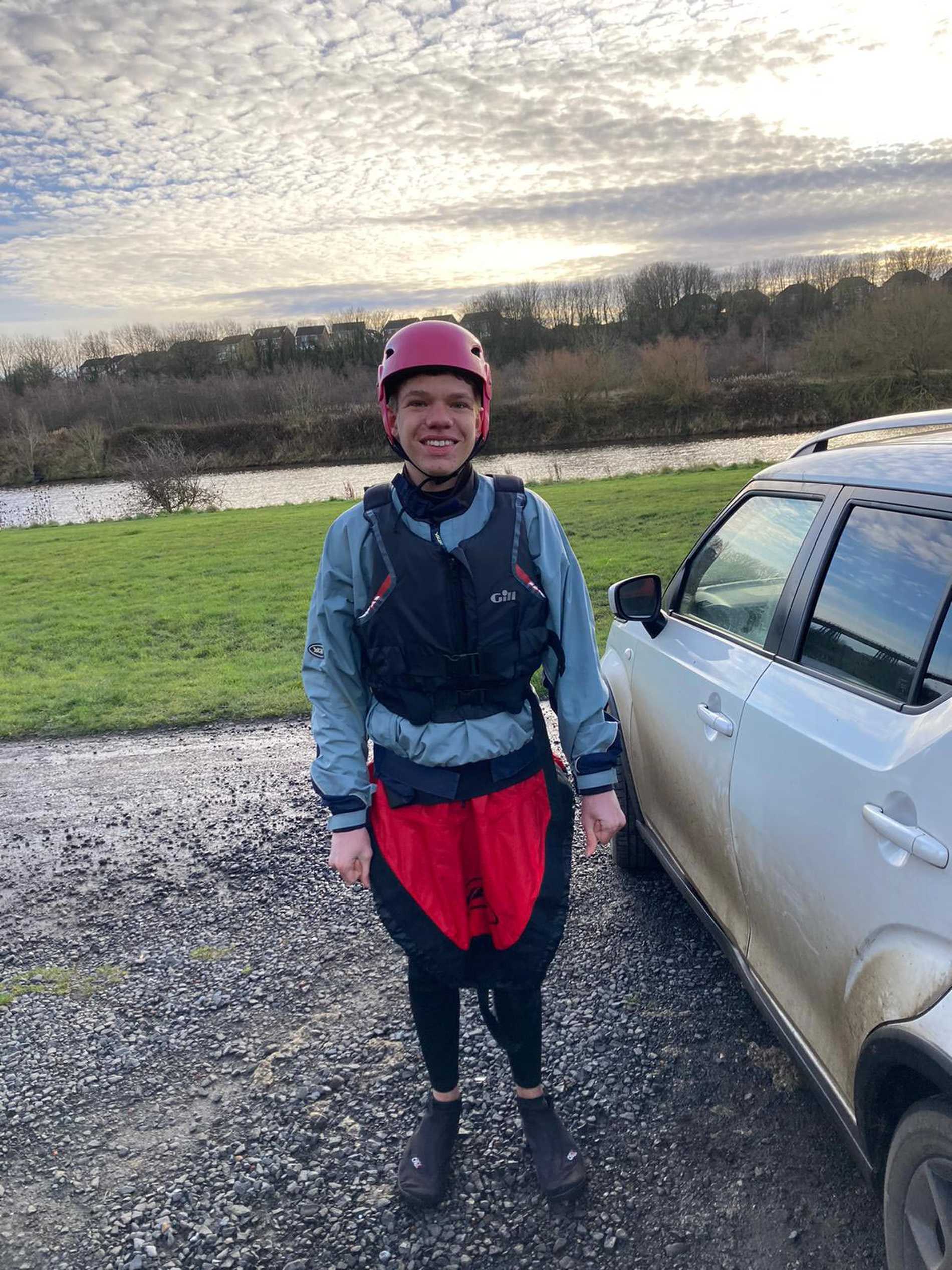 Sam in his wetsuit, ready to go kayaking.