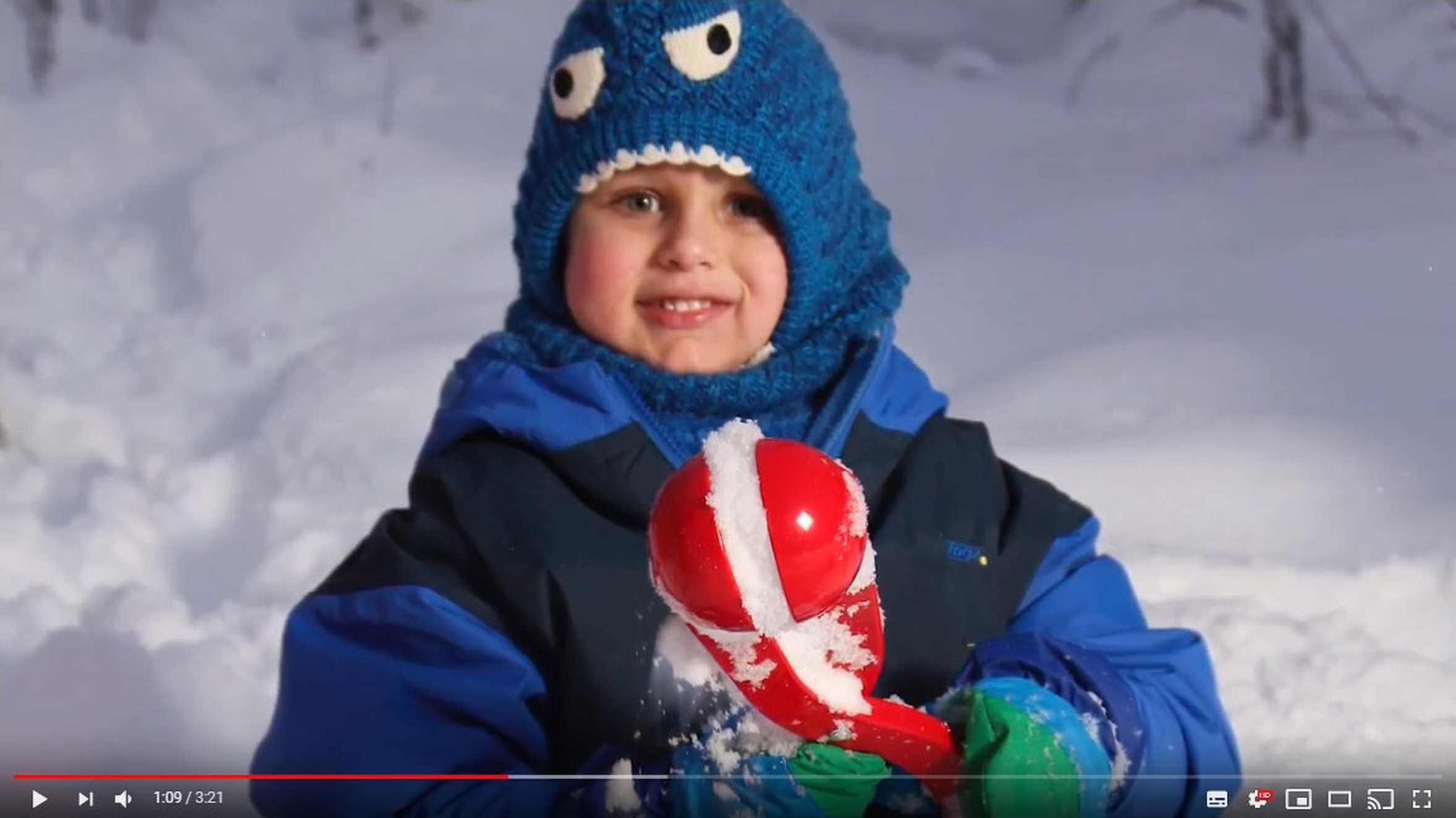 Wish child Finn playing in the snow in Lapland, taken from a video about the impact of his wish