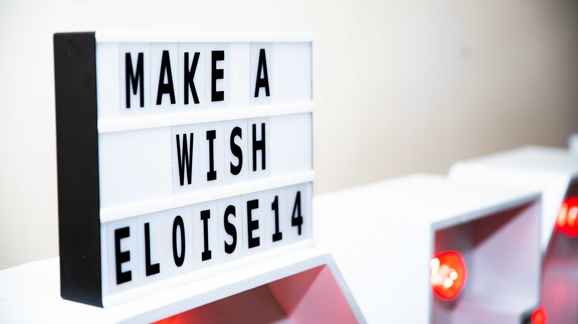 A cinema-style sign spelling out the words "Make-A-Wish Eloise 14"