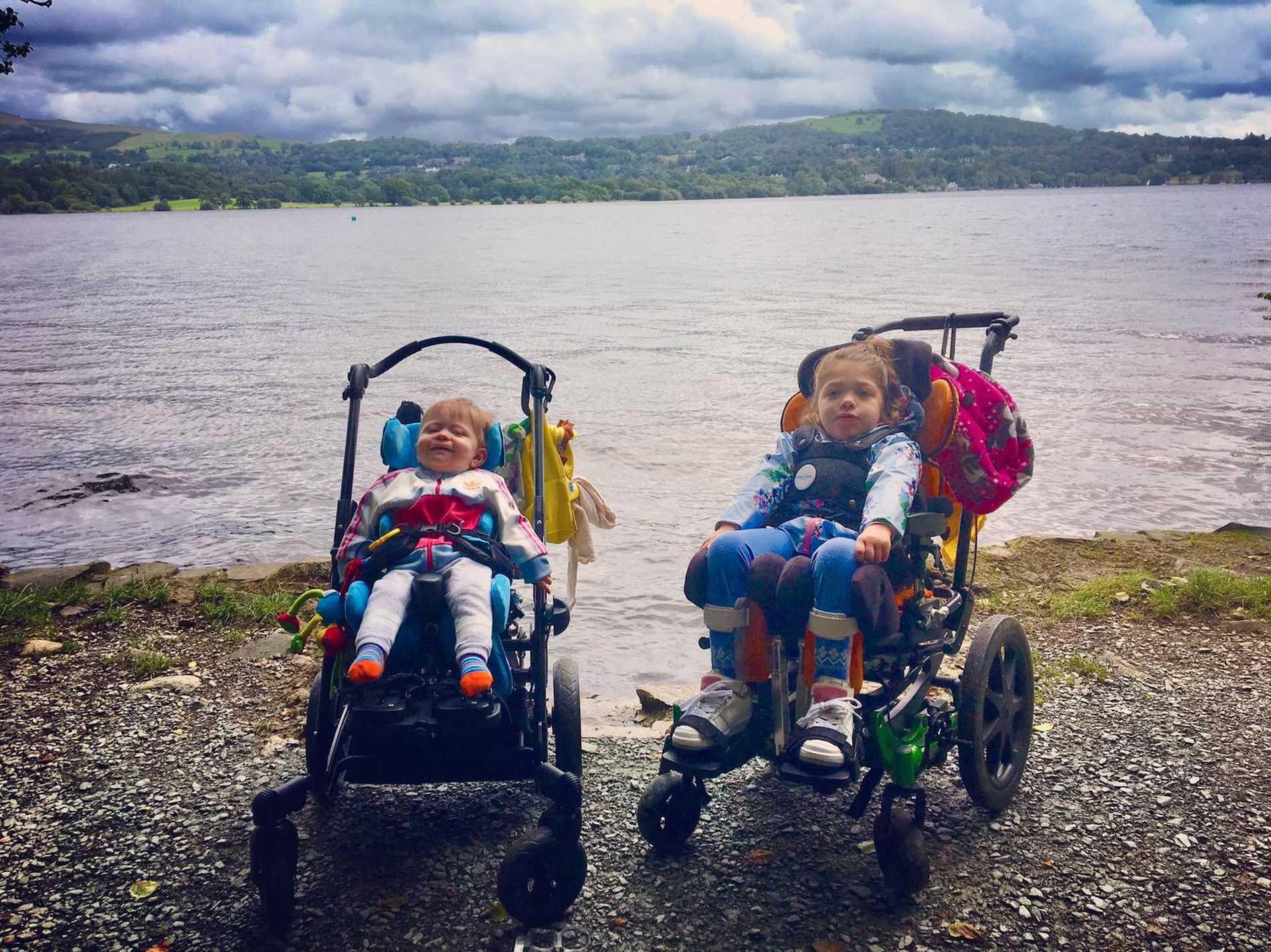 Aubree and her brother on the lake shore during their trip to the Lake District.