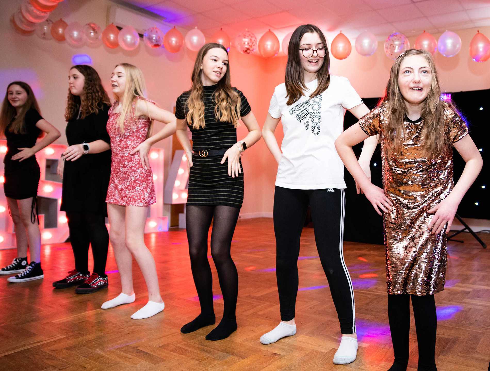 Eloise and her friends dancing during her party.