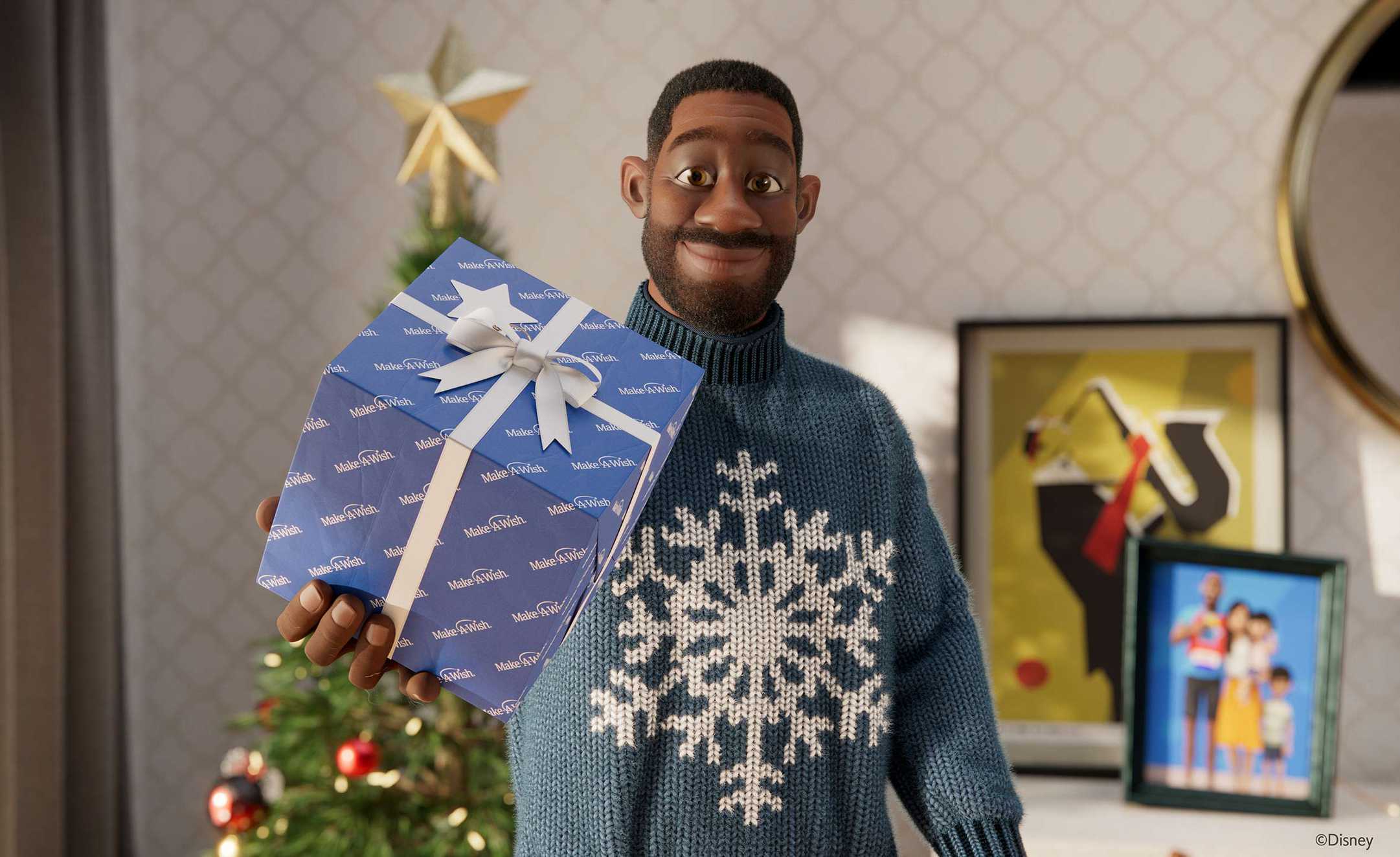 The stepdad from Disney's advert, holding up a Christmas present wrapped in blue paper.