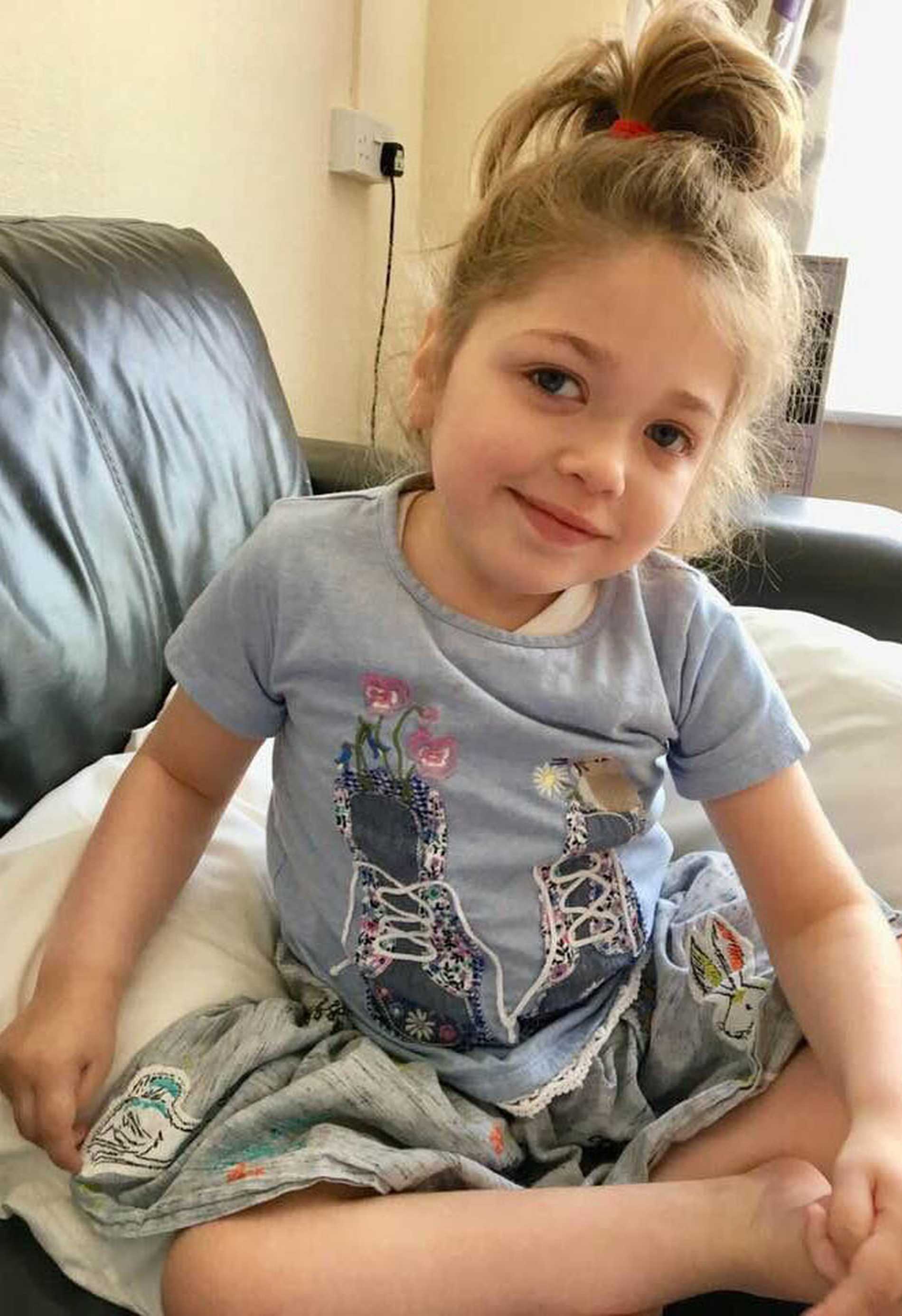 Aubree sitting on the sofa at home