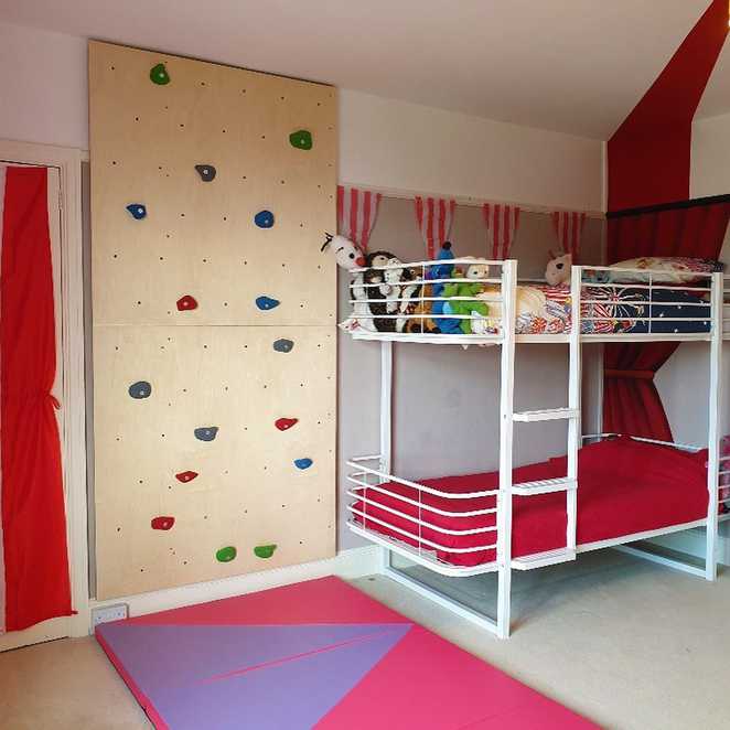 Lottie now has a climbing wall next to her bunk beds.