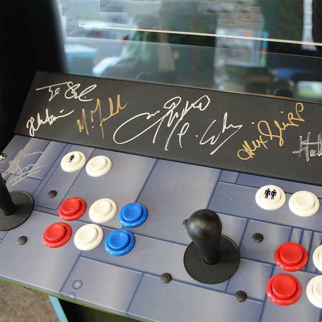Close up of an X-men: Children of the Atom arcade machine, signed by the cast of cast members of X-Men: Dark Phoenix.
