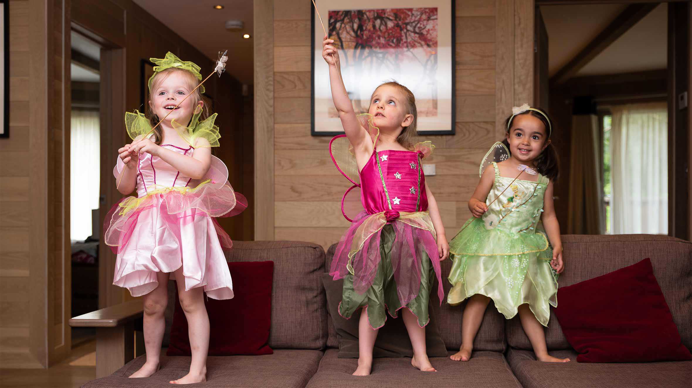 Elsie playing with her cousins and her magic wand