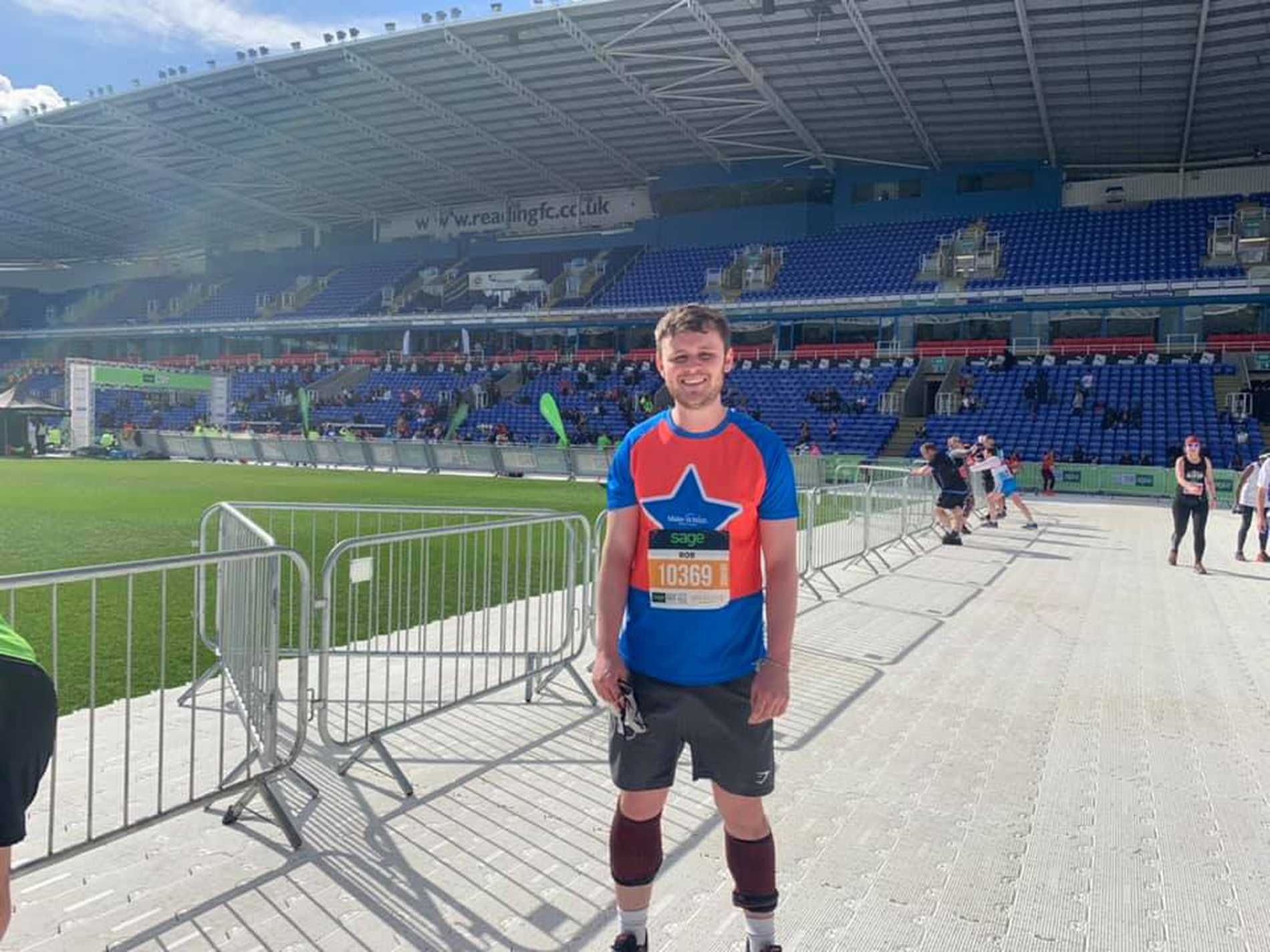 A smiling #WishHero in the Madjeski Stadium after completing the Reading Half Marathon.