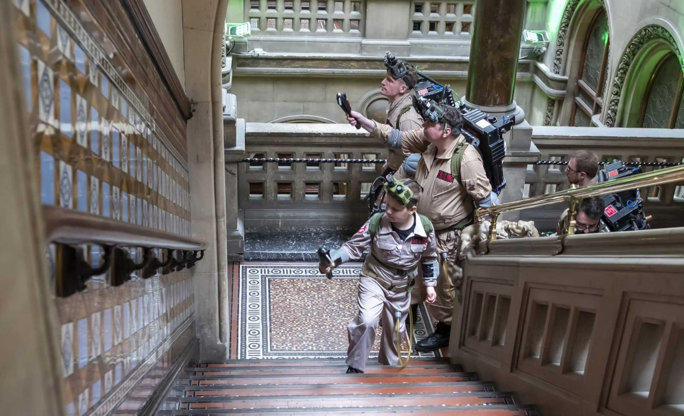 George and his fellow Ghostbusters ascending the grand staircase at Leeds Library.