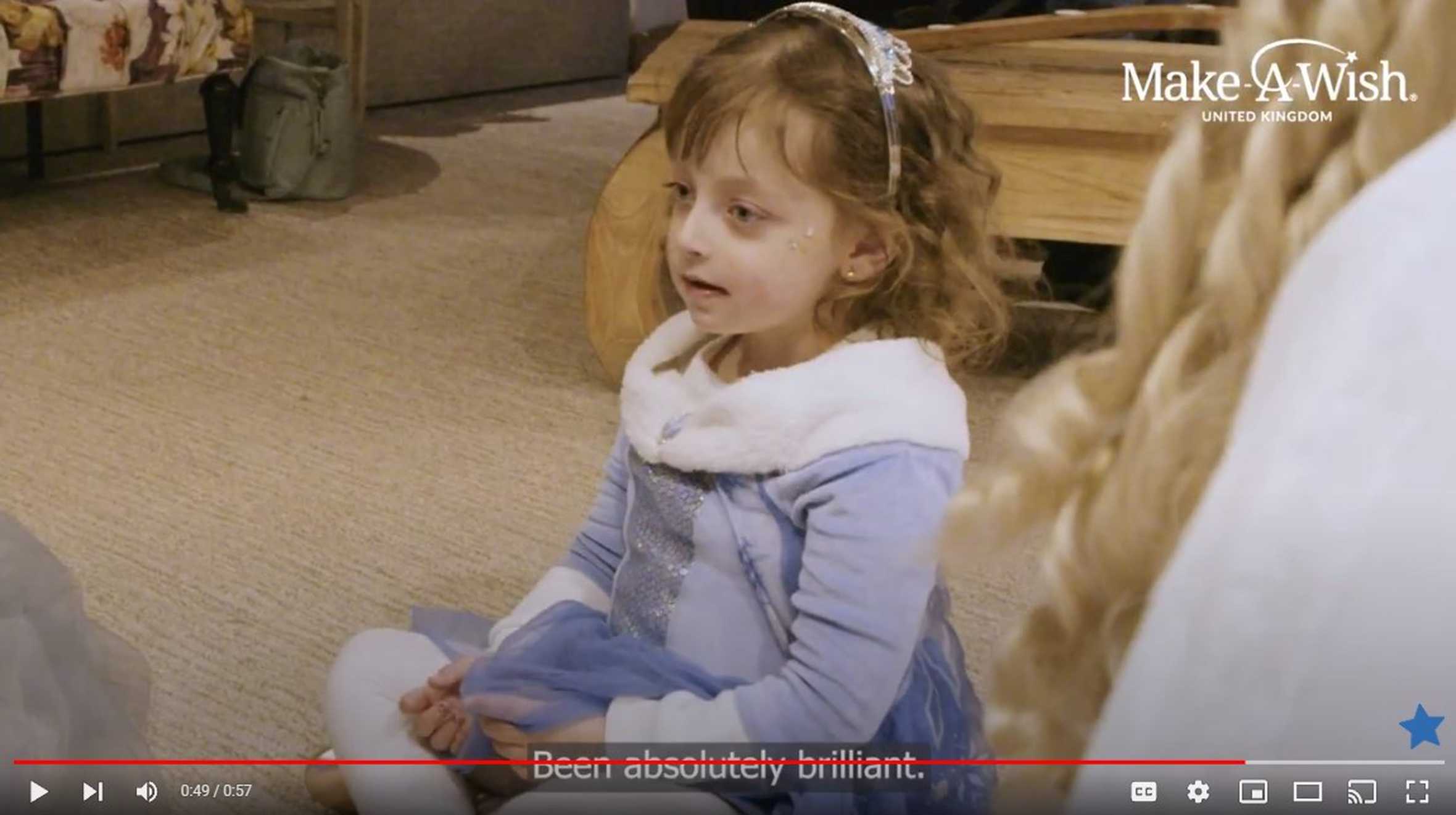 A still taken from the video of Alyssia's wish, showing Alyssia in her princess dress.