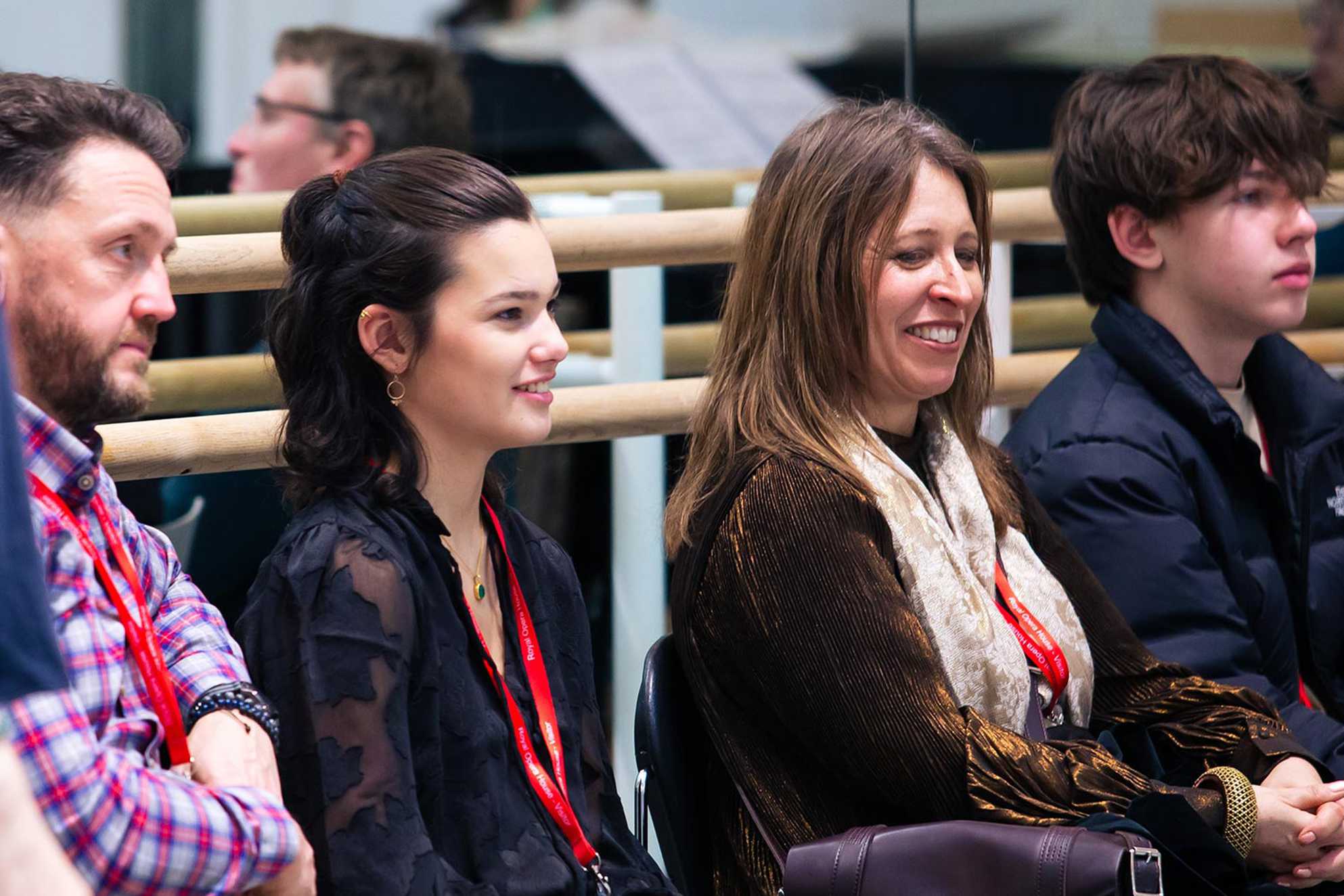 Izzy watching the rehearsal with her mum and dad.