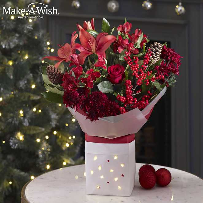 Red Christmas bouquet being sold by Next in aid of Make-A-Wish UK.