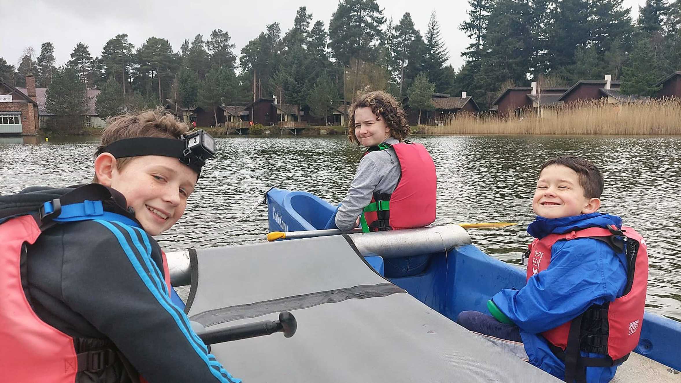 Daisy and her brothers on the boating lake during her wish.