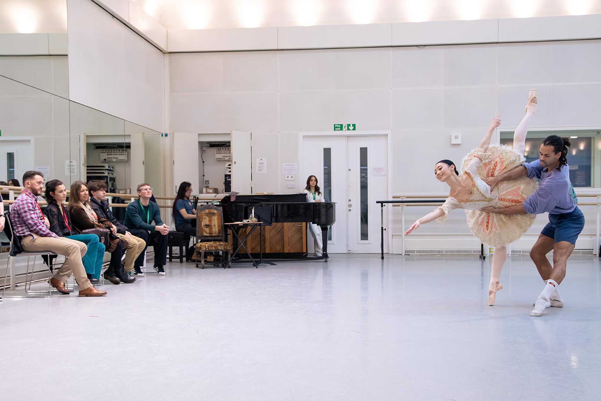 Izzy and her family watching Royal Ballet dancers Joseph Sissens and Mariko Sasaki rehearsing.