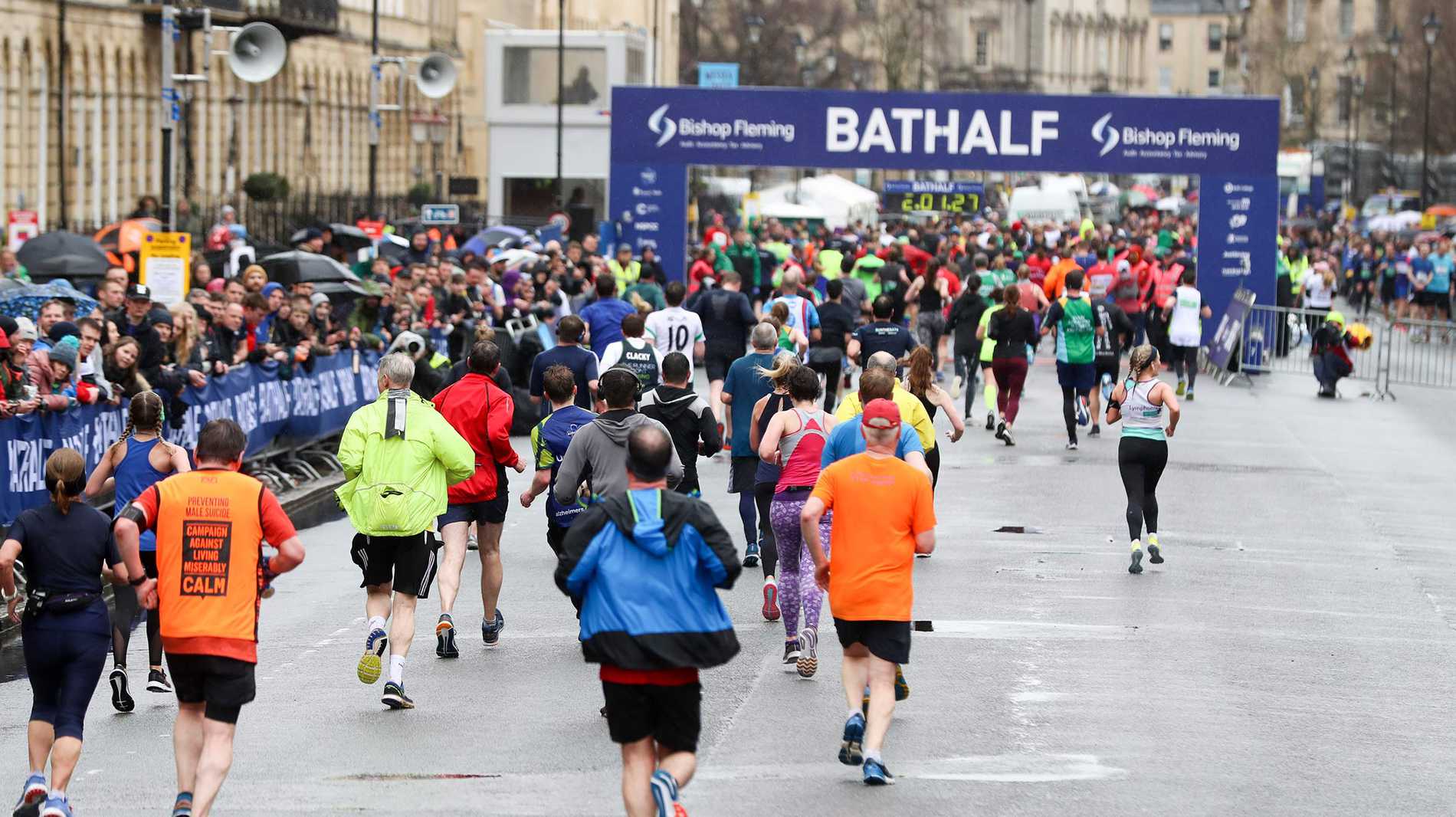 Runners arriving at the finish line of the Bath Half Marathon.