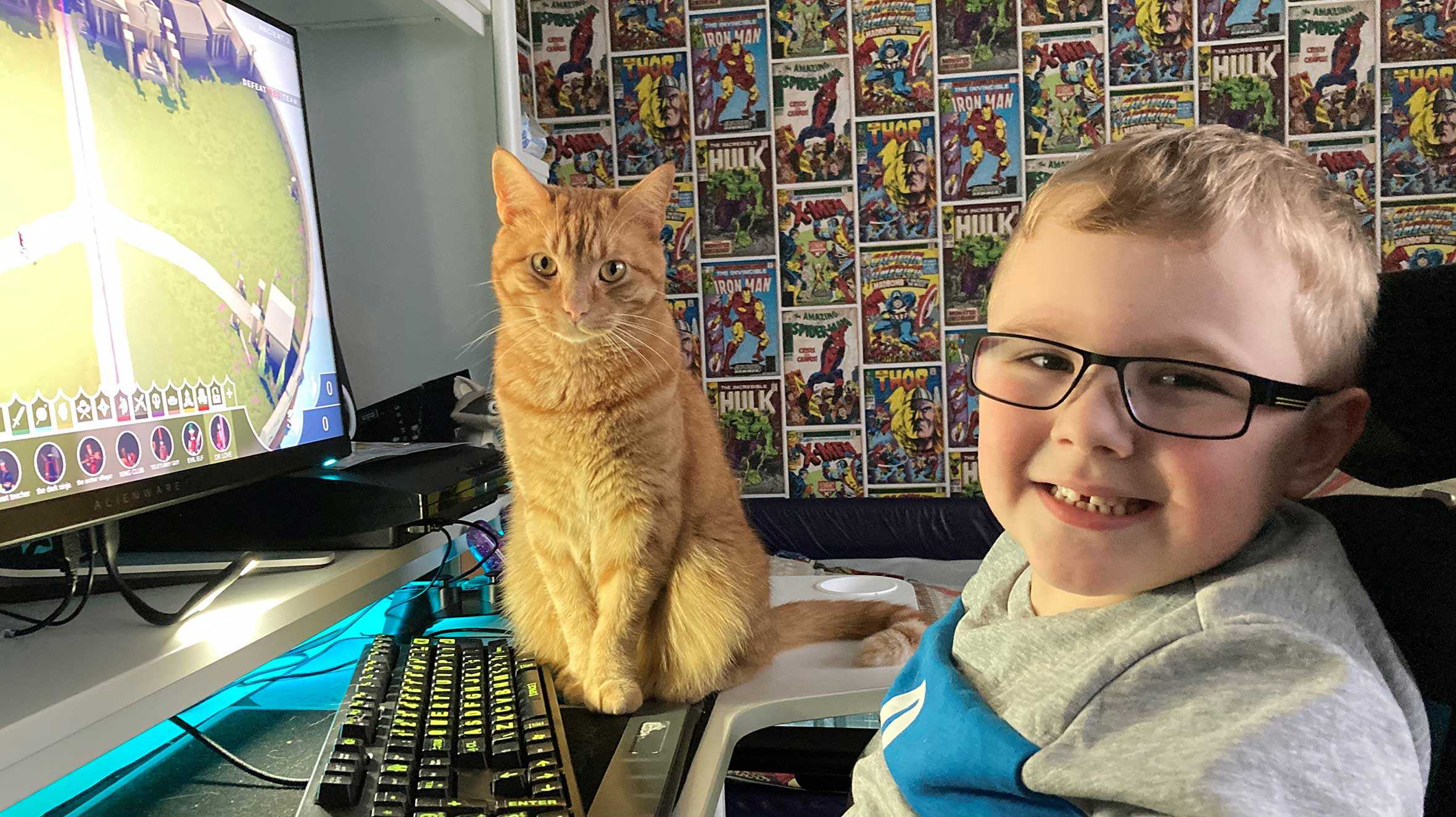 Harrison's cat supervising while he plays on his new gaming PC.