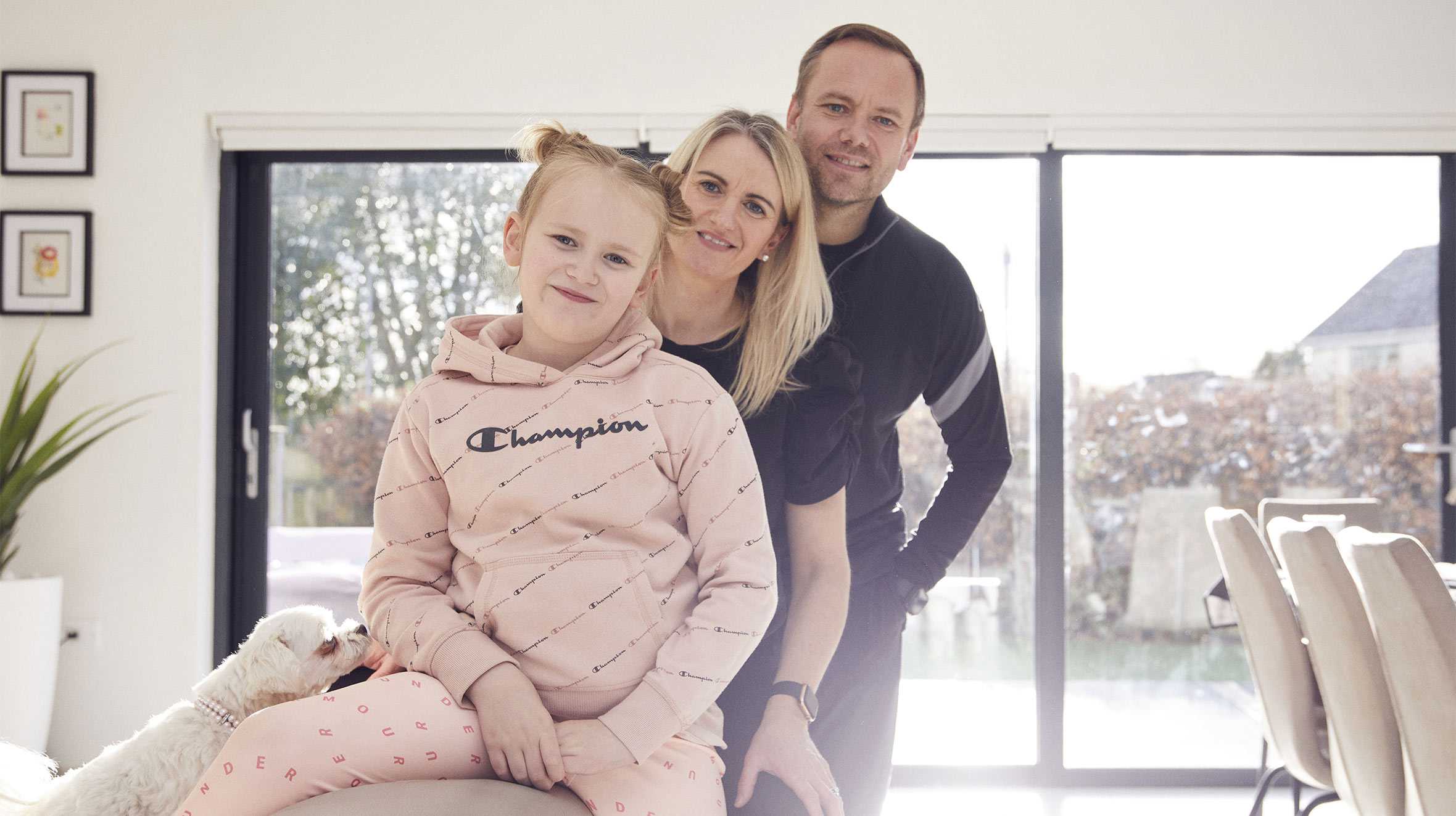 Isla at home with her mum and dad.