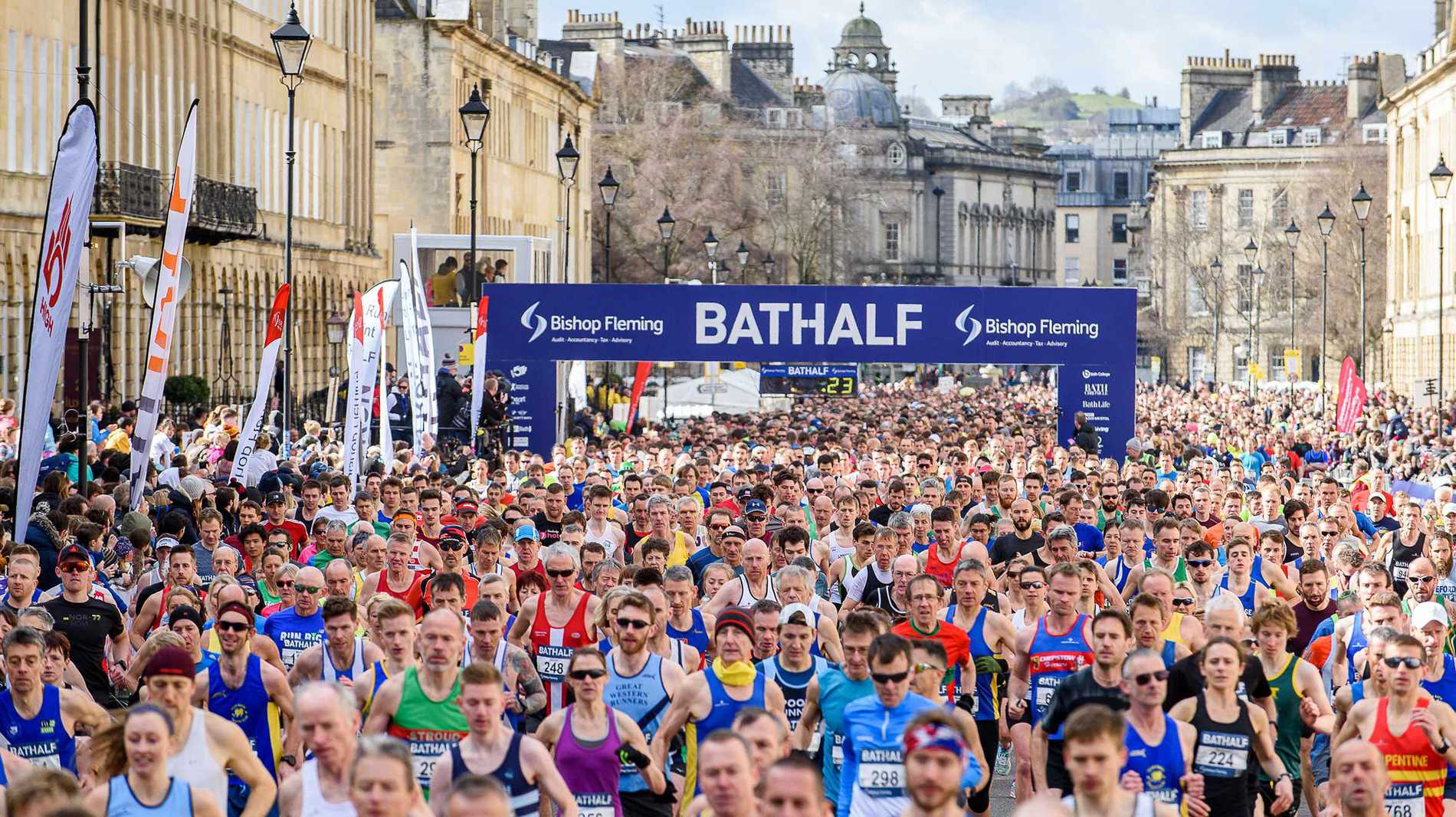 A large crowd of runners setting off at the start of the Bath Half Marathon.