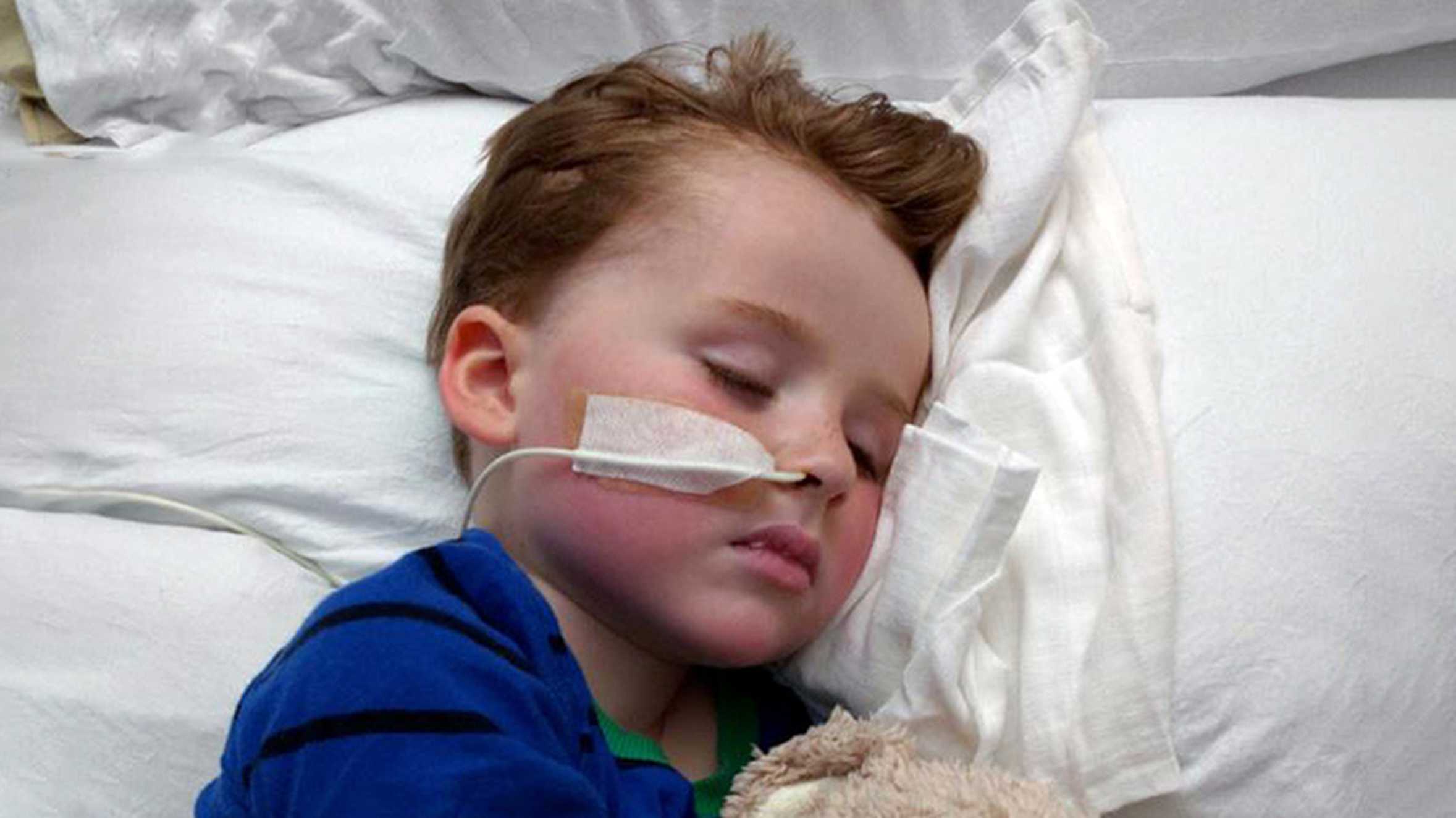 Joseph asleep in his hospital bed during his treatment