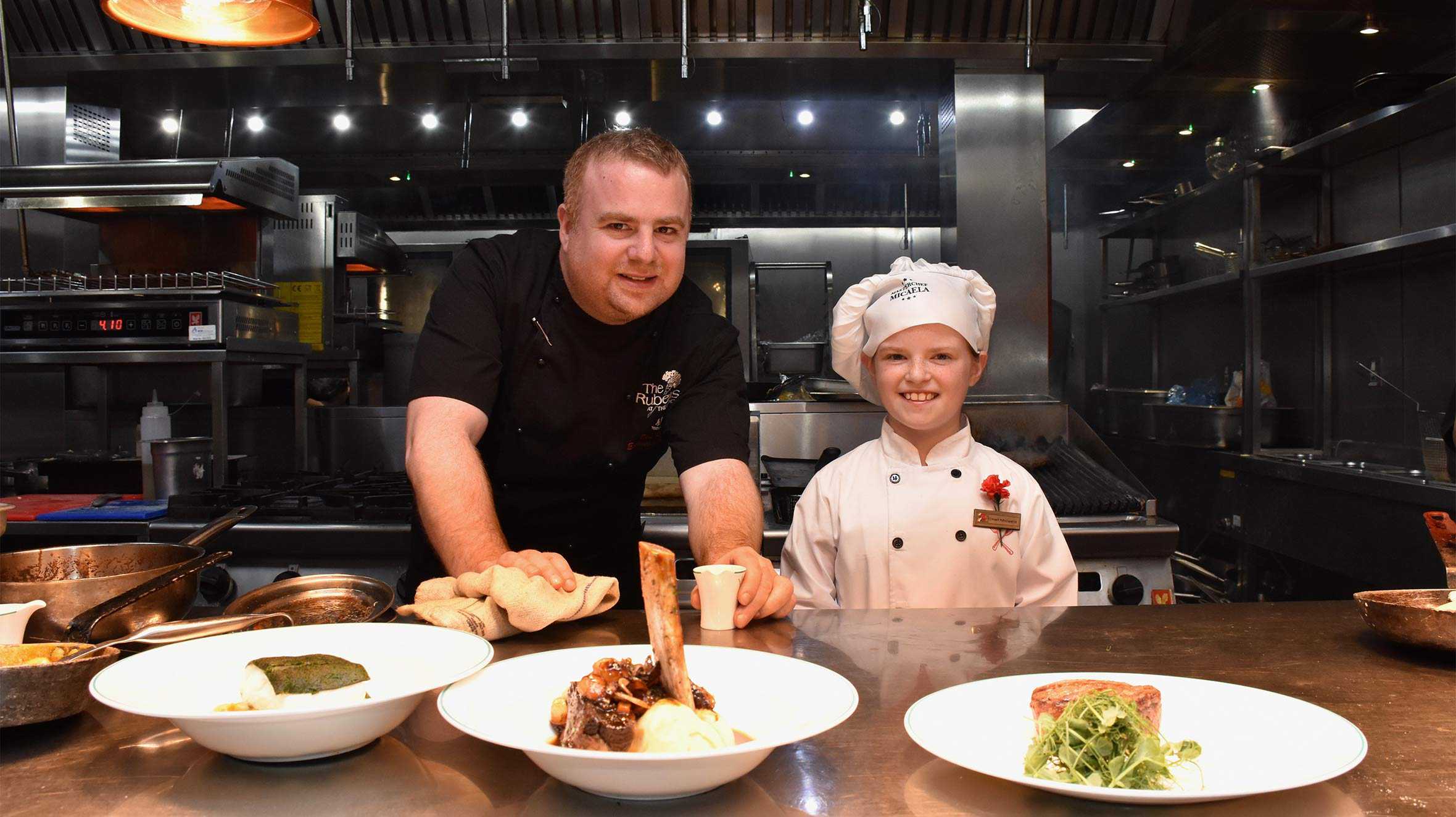 Micaela, standing with Reubens Hotel Executive Head Chef, Ben.