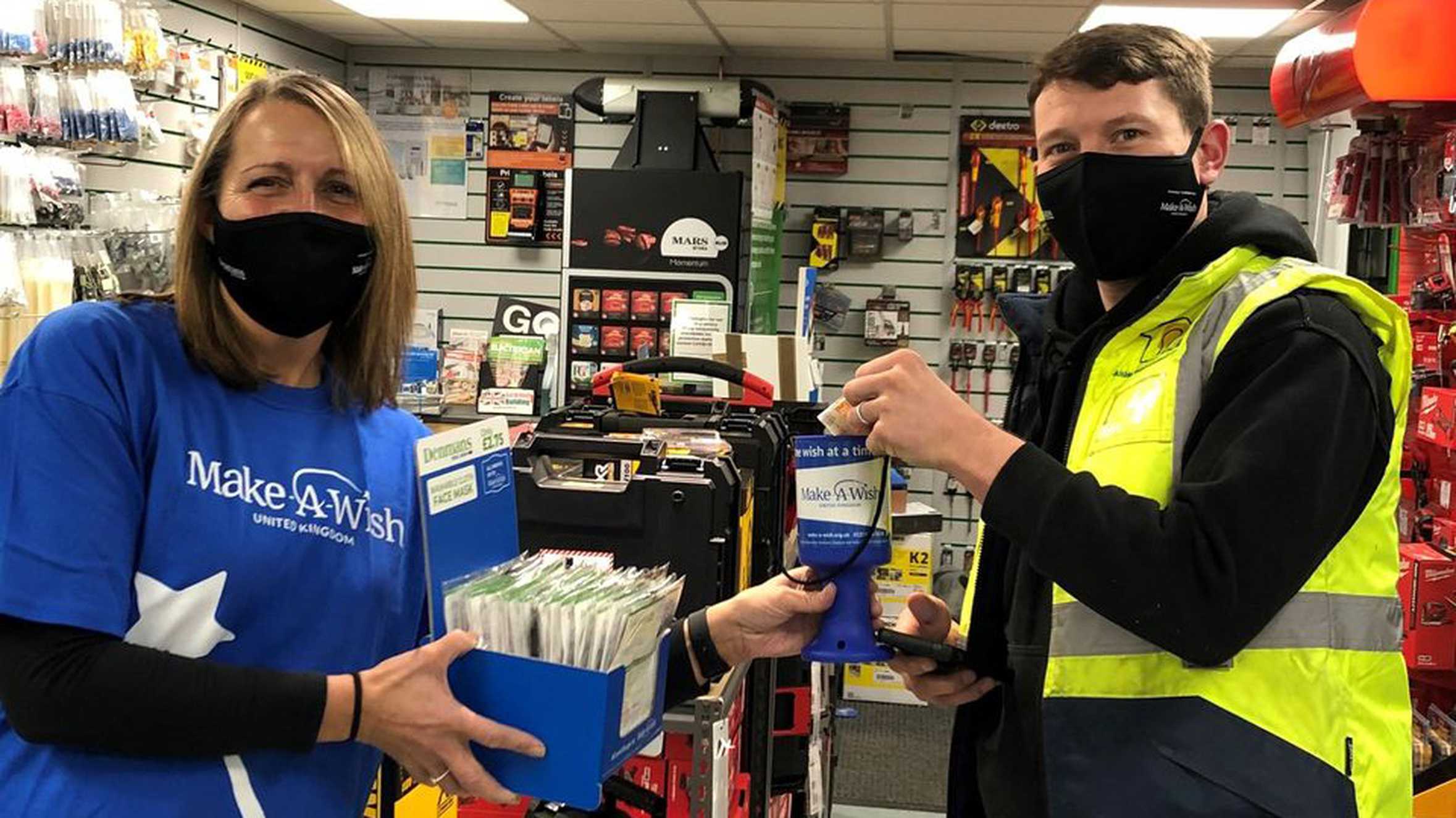 A Make-a-Wish supporter selling facemasks in a Denmans outlet to raise money for wishes.