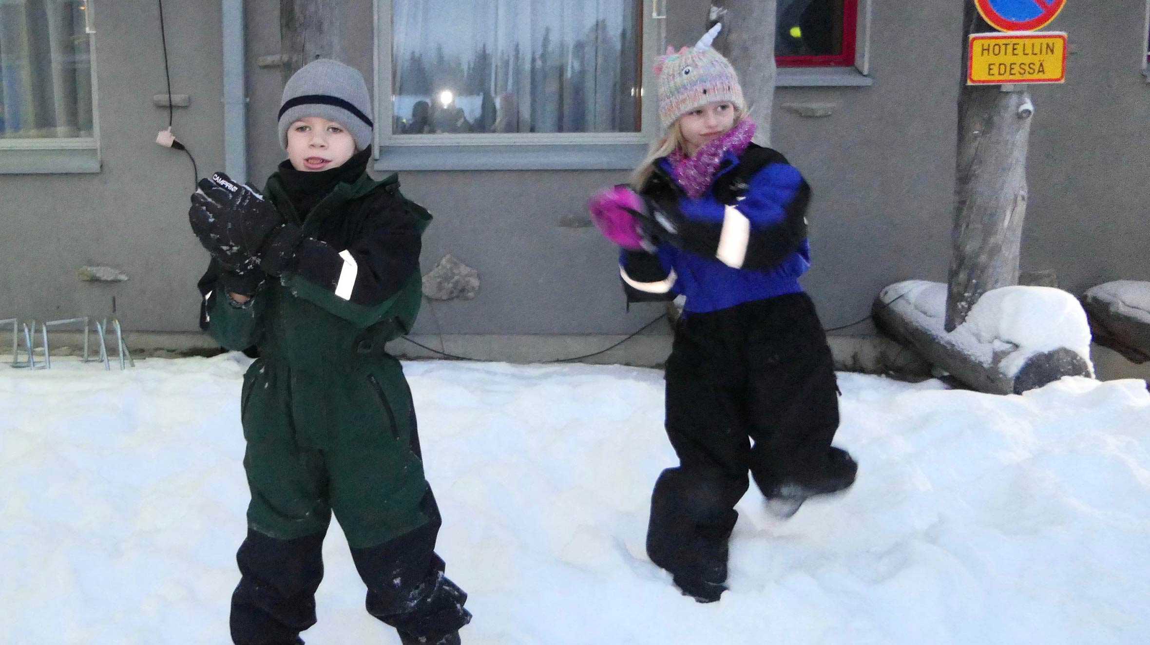 Robbie and his sister, Annabelle playing in the snow during their trip to Lapland