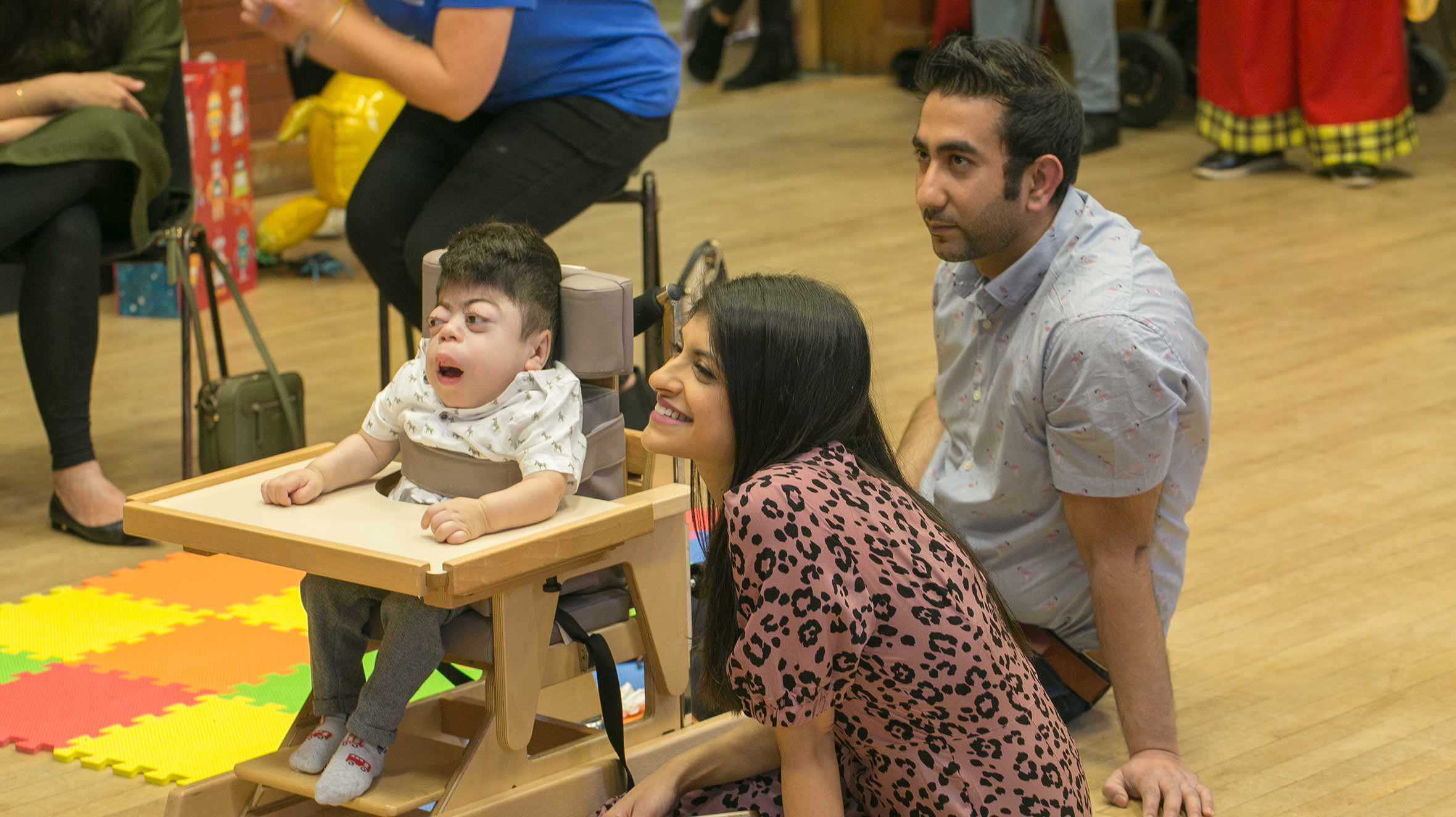 Adnan enjoying Lion King the Musical with his mum and dad