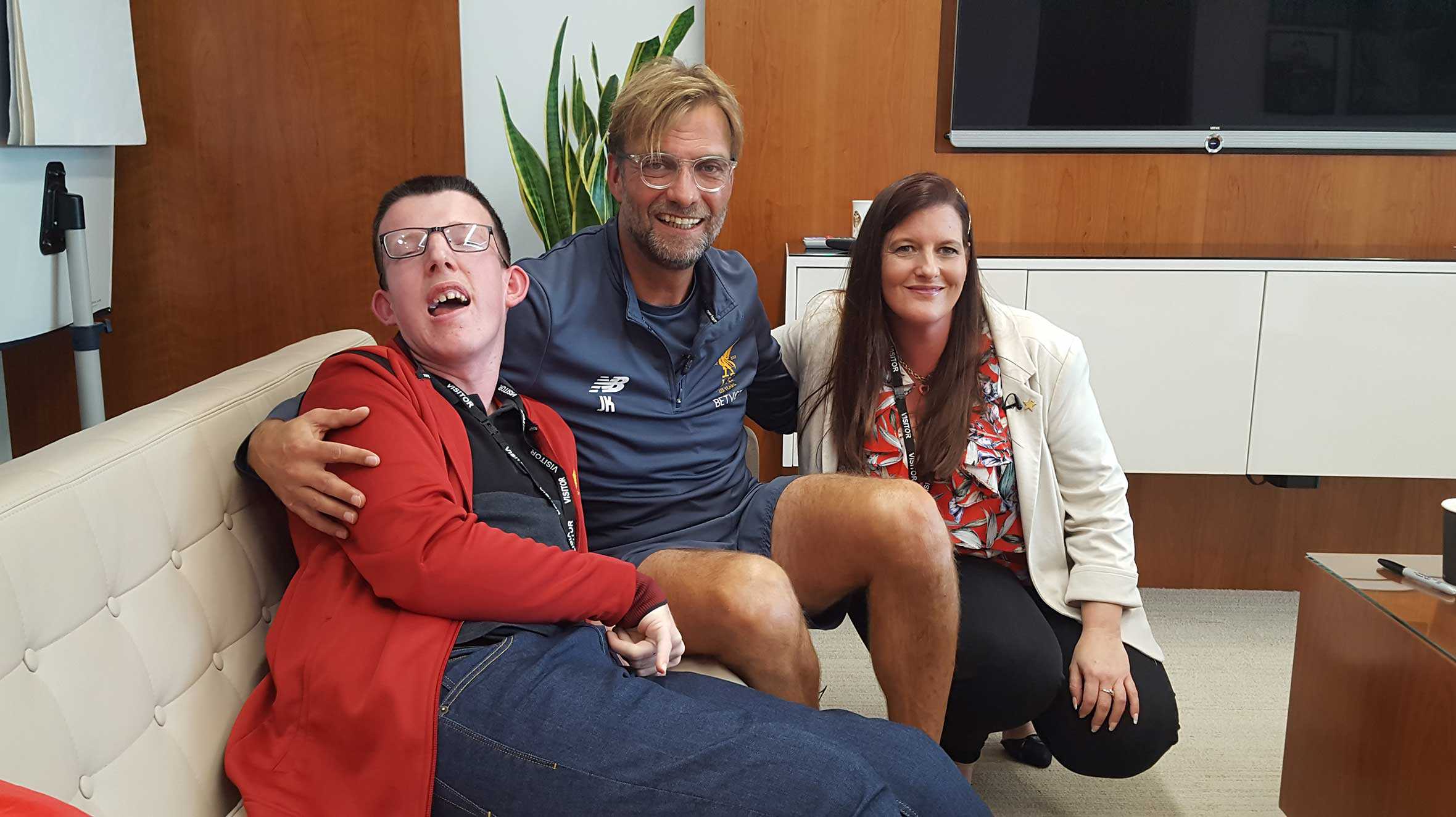 Loyd and his mum with Liverpool F.C. Manager, Jurgen Klopp