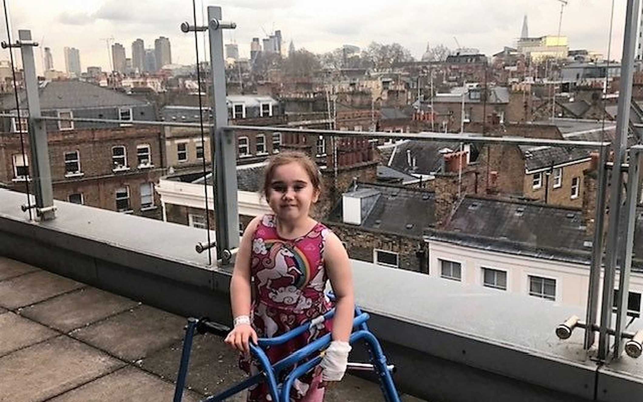 Angel on the balcony at GOSH, with The Shard visible in the distance.