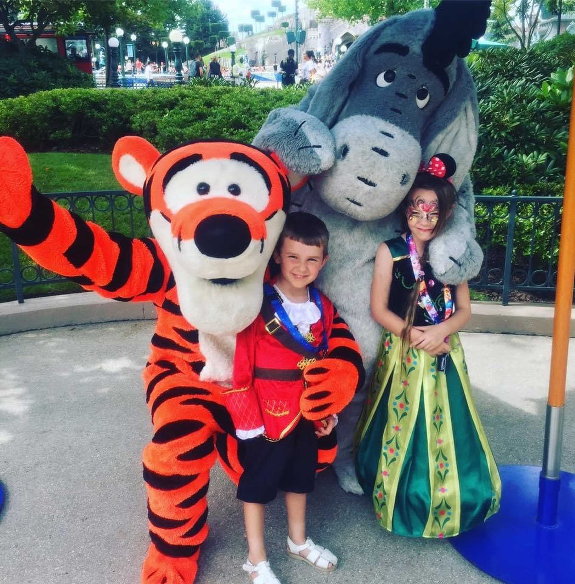 Isaac and his sister with Tigger and Eeyore.