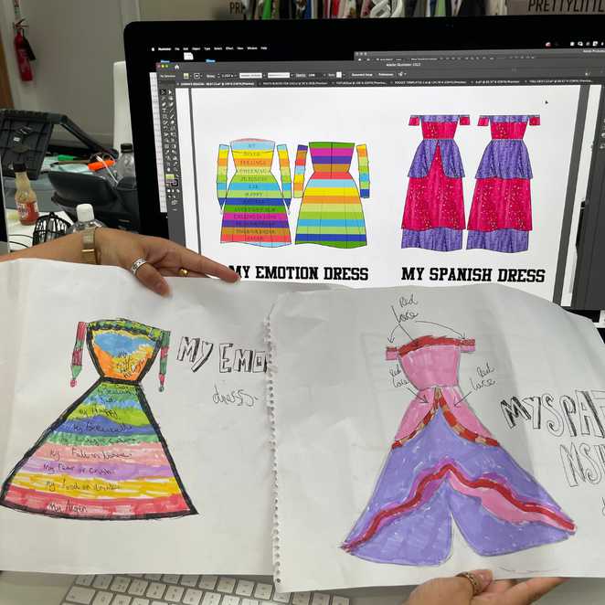 Comparing some of Sienna's hand-drawn designs with the digital versions on a computer screen.
