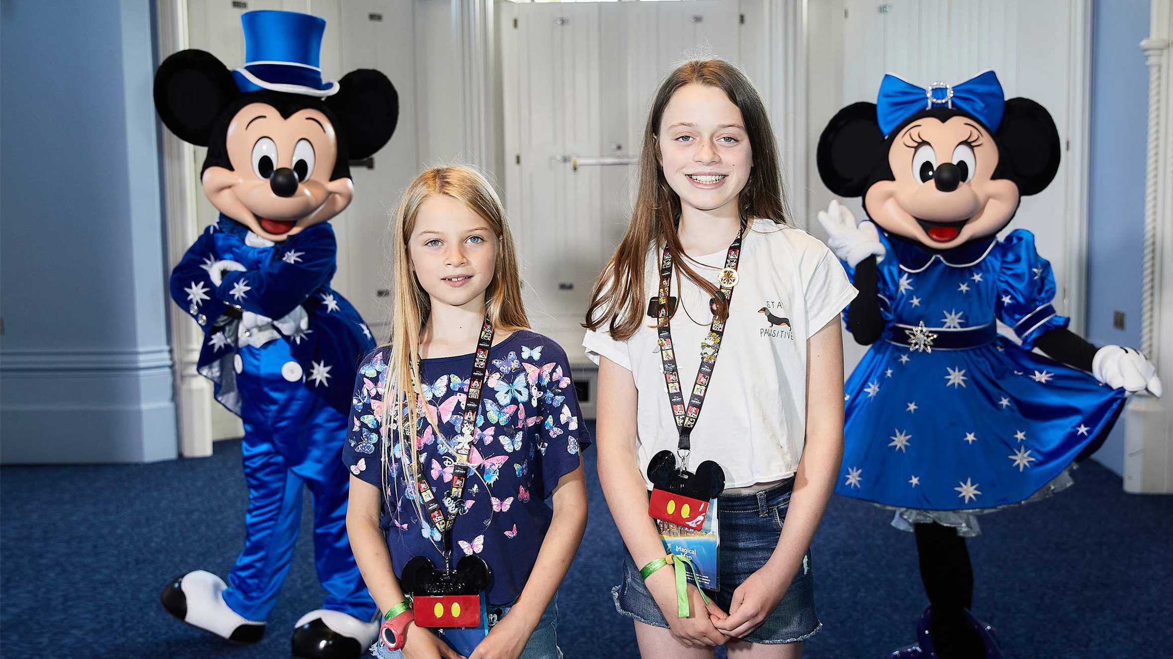 Chloe and her sister Tabatha with Mickey and Minnie