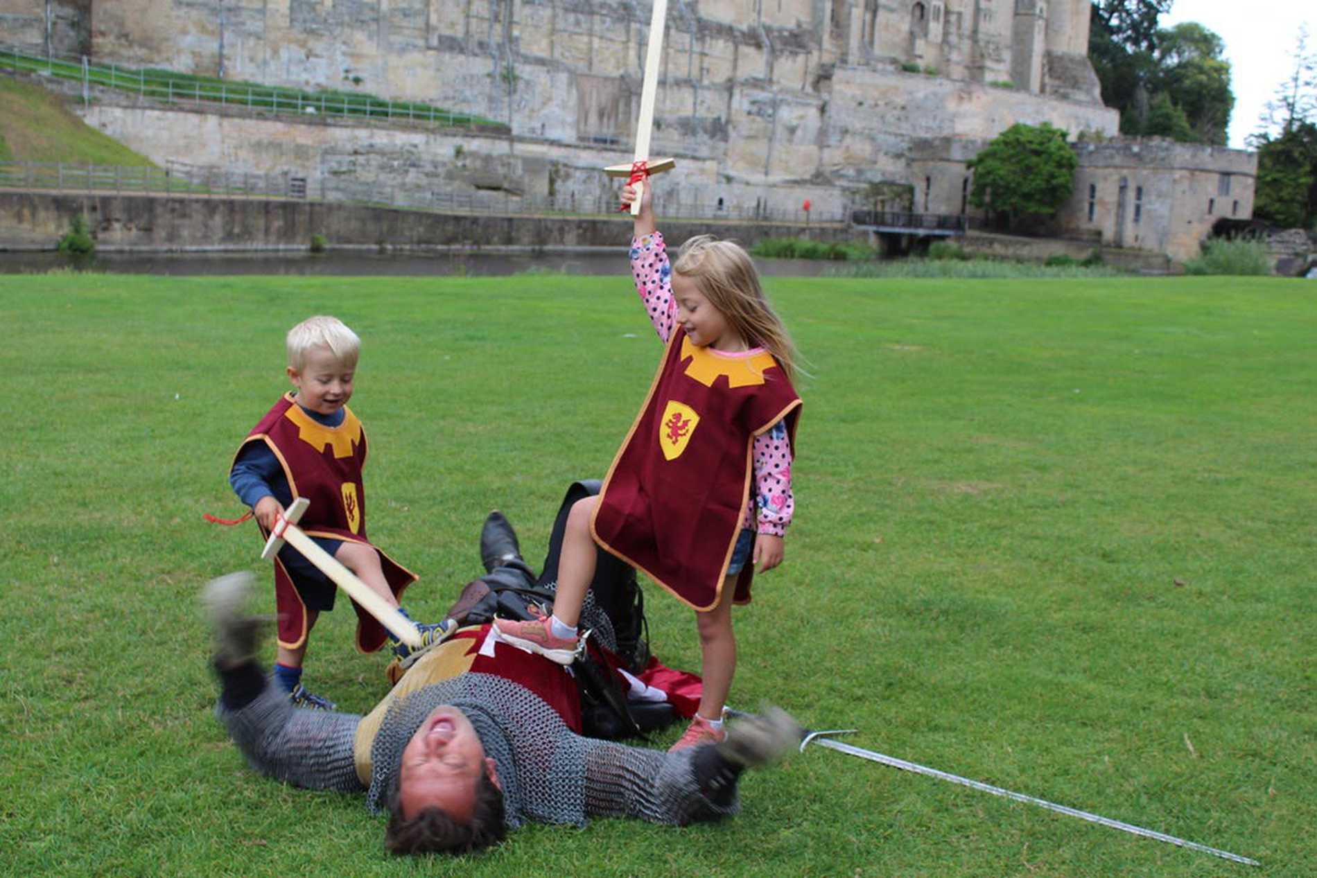 Hunor and his sister, Dorka celebrating after defeating a knight in battle.