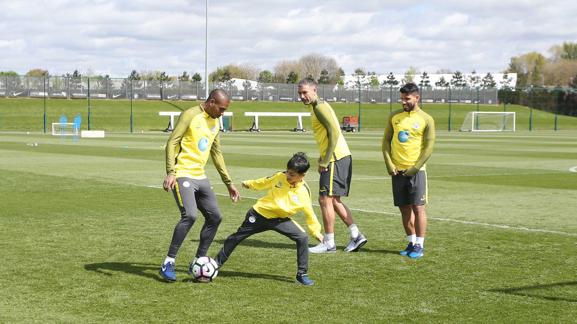 Idris playing football with some of the Man City players