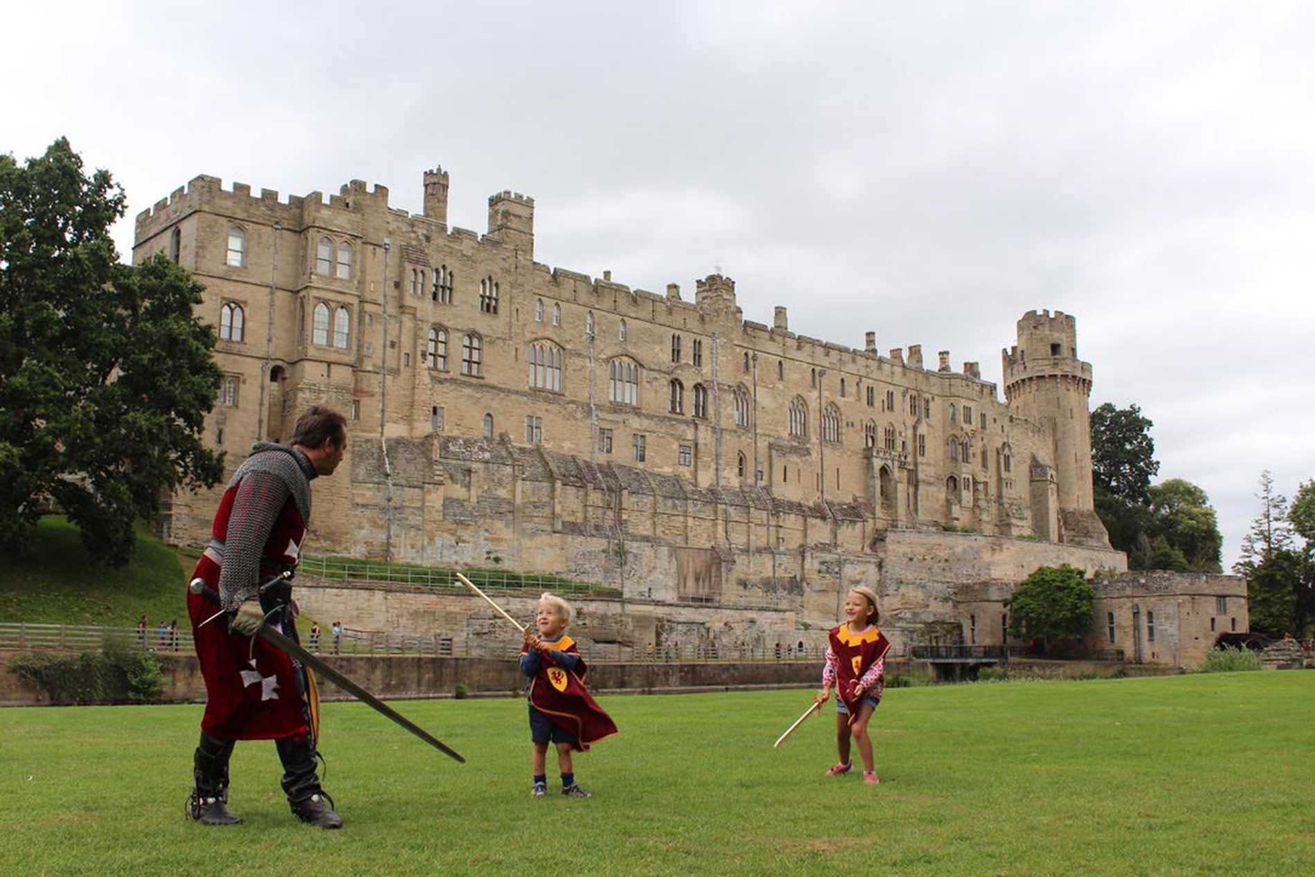 Hunor and his sister, Dorka fighting a knight with Warwick Castle in the background.