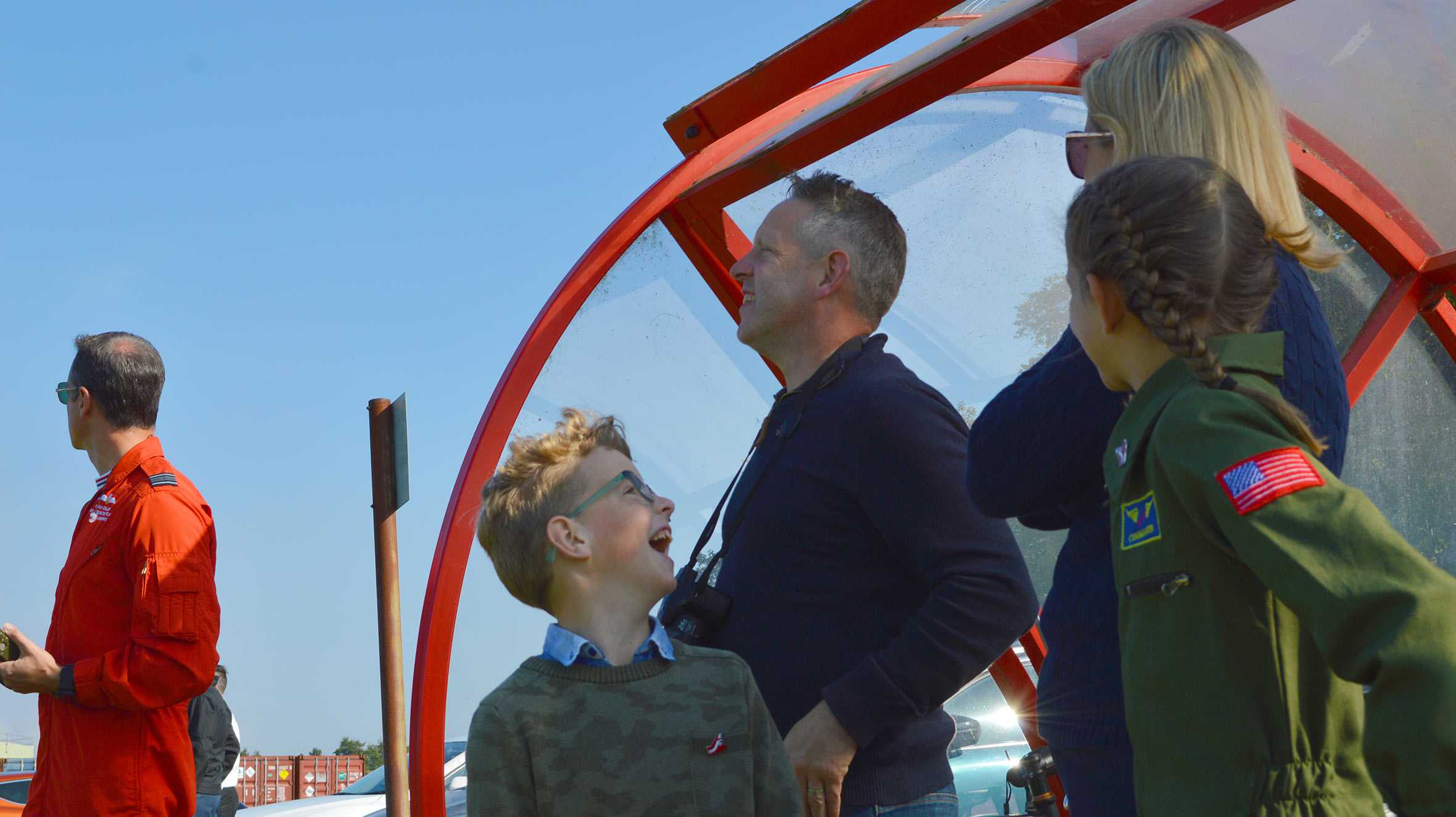 Wish child, John and his family enjoying a Red Arrows aerobatic display during his wish.